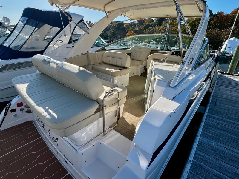 Slide: The Image of 2018 Regal 33 Express boat interior with beige seating and sleek design. - 26