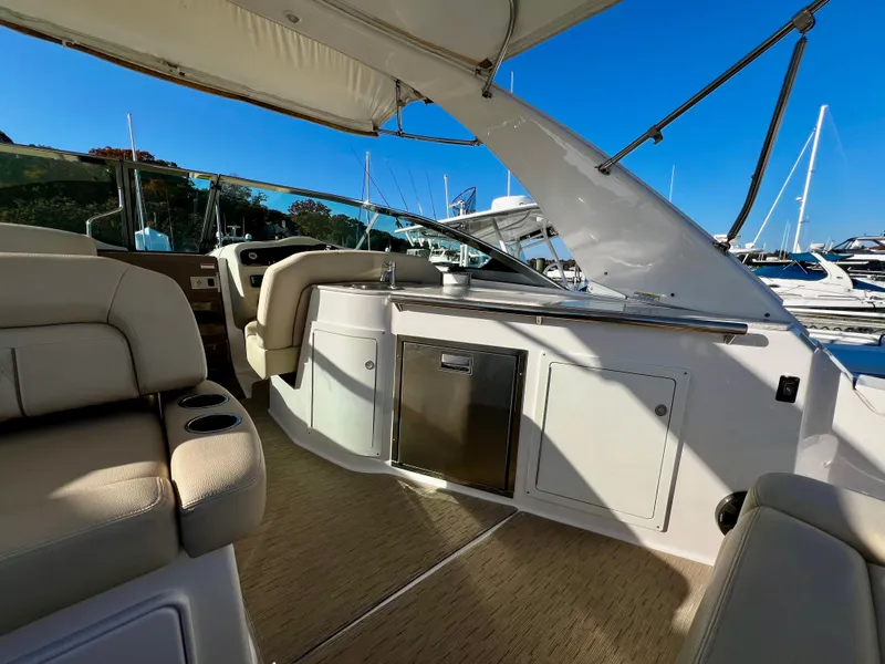 Slide: The Image of Luxurious interior of 2018 Regal 33 Express boat with beige seating and sleek design. - 27