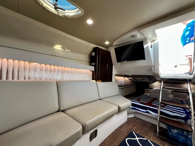 Slide: The Image of Interior of 2018 Regal 33 Express yacht with modern seating and TV. - 40