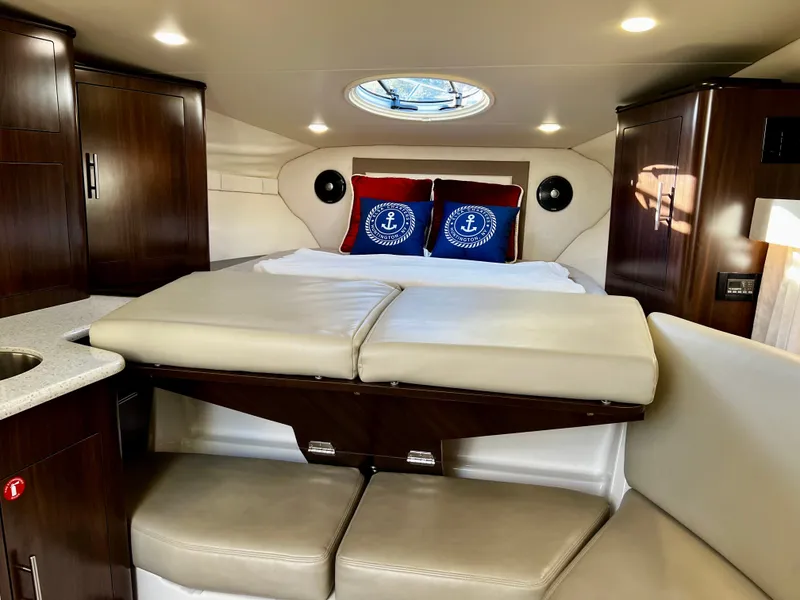 Slide: The Image of Luxurious interior of 2018 Regal 33 Express yacht with cozy bed and elegant wood cabinetry. - 41