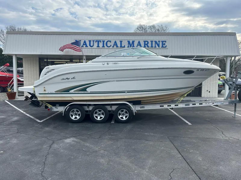 The Image of 2001 Sea Ray 245 Weekender boat on trailer at Nautical Marine dealership. - 0