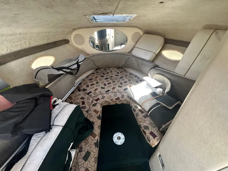 Slide: The Image of Interior of 2001 Sea Ray 245 Weekender boat with seating and storage. - 10