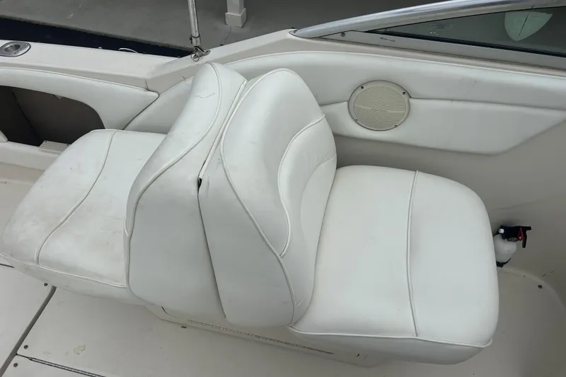Slide: The Image of White leather seats on a 2001 Sea Ray 245 Weekender boat interior. - 13