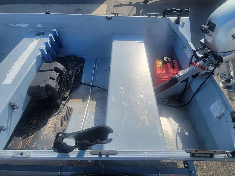 Slide: The Image of 2006 G3 Guide V12 boat interior with motor and equipment. - 9