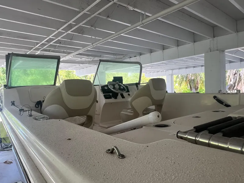 Slide: The Image of 2021 Carolina Skiff 21 LS Sport & Fish DC boat interior under covered dock. - 3