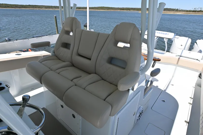 Slide: The Image of Luxurious seating on 2024 Freeman 37 VH boat with scenic water backdrop. - 14