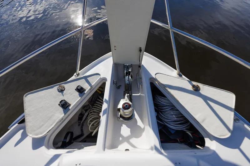 Slide: The Image of Bow of 2003 Regal Commodore 3880 yacht with anchor and storage compartments. - 29