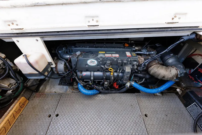 Slide: The Image of Engine compartment of a 2003 Regal Commodore 3880 boat, showcasing mechanical components. - 33