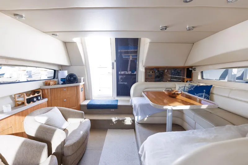 Slide: The Image of Luxurious interior of 2003 Regal Commodore 3880 yacht with seating and dining area. - 43