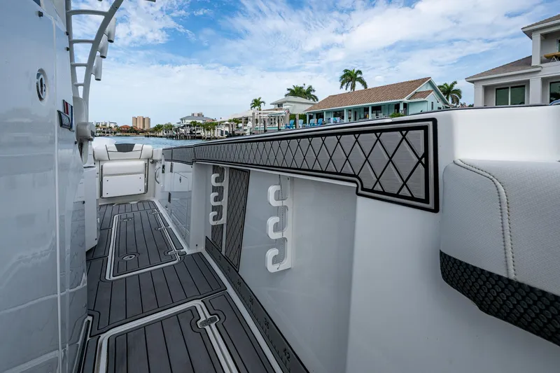 Slide: The Image of 2020 Wellcraft 302 Fisherman boat deck with modern design and waterfront view. - 30