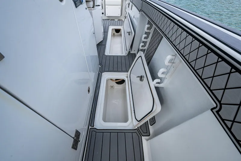 Slide: The Image of 2020 Wellcraft 302 Fisherman boat interior with open storage compartments. - 34
