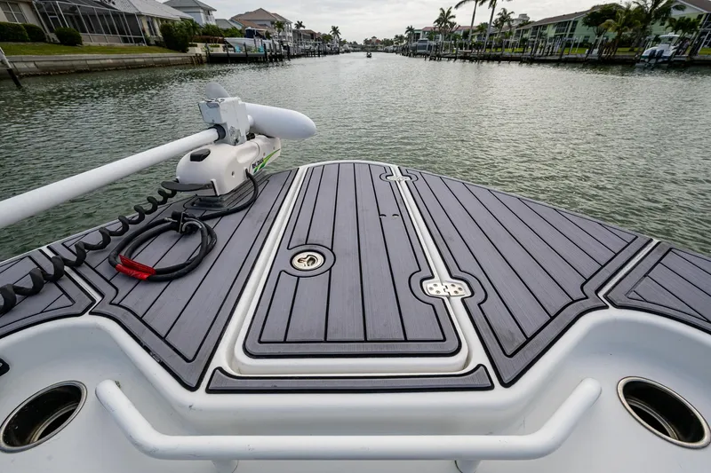 Slide: The Image of 2020 Wellcraft 302 Fisherman boat deck on a calm waterway. - 42