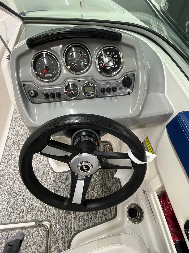 Slide: The Image of 2017 Chaparral 19H20 boat dashboard with steering wheel and instrument panel. - 15