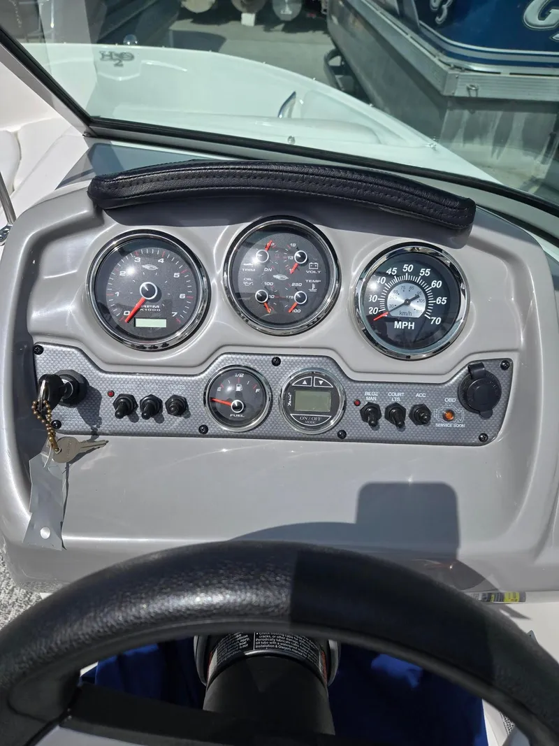 Slide: The Image of Dashboard of a 2017 Chaparral 19H20 boat with gauges and controls. - 16