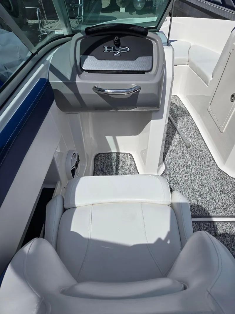 Slide: The Image of 2017 Chaparral 19H20 boat interior with white seating and H2 console. - 17