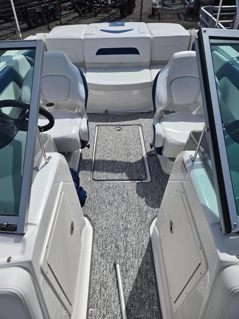 Slide: The Image of 2017 Chaparral 19H20 boat interior with seating and steering wheel. - 7