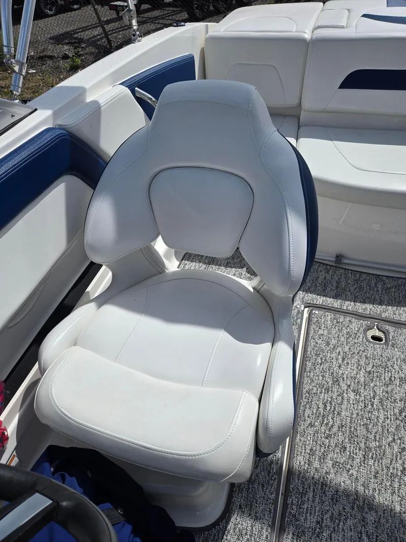 Slide: The Image of 2017 Chaparral 19H20 boat interior with white and blue seating. - 8