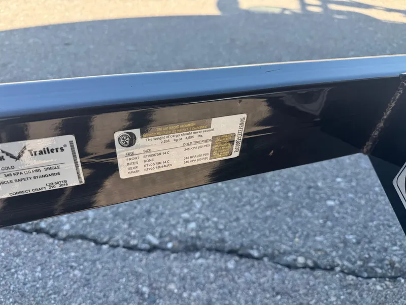 Slide: The Image of Trailer label for Nautique 210, 2016 model, showing tire and load specifications. - 39