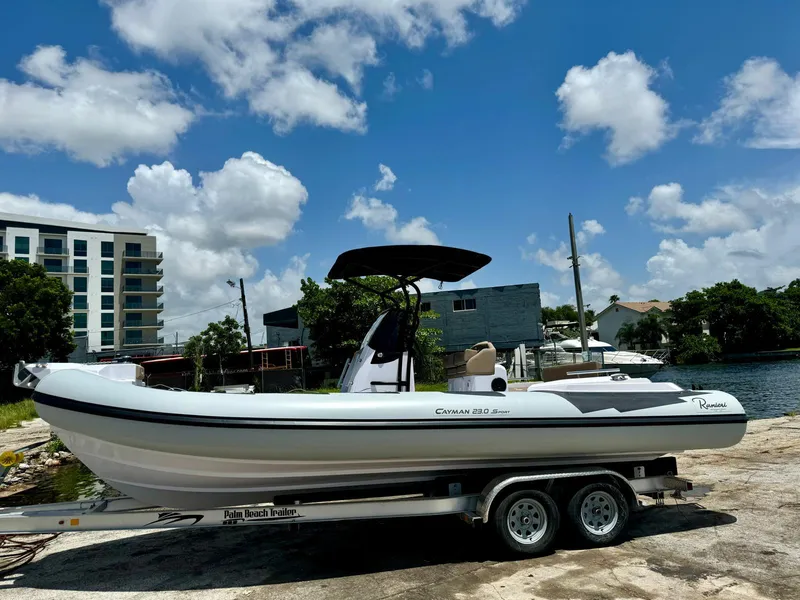 Slide: The Image of 2026 Ranieri CAYMAN 23 Sport boat on calm water, featuring sleek design and modern amenities. - 1