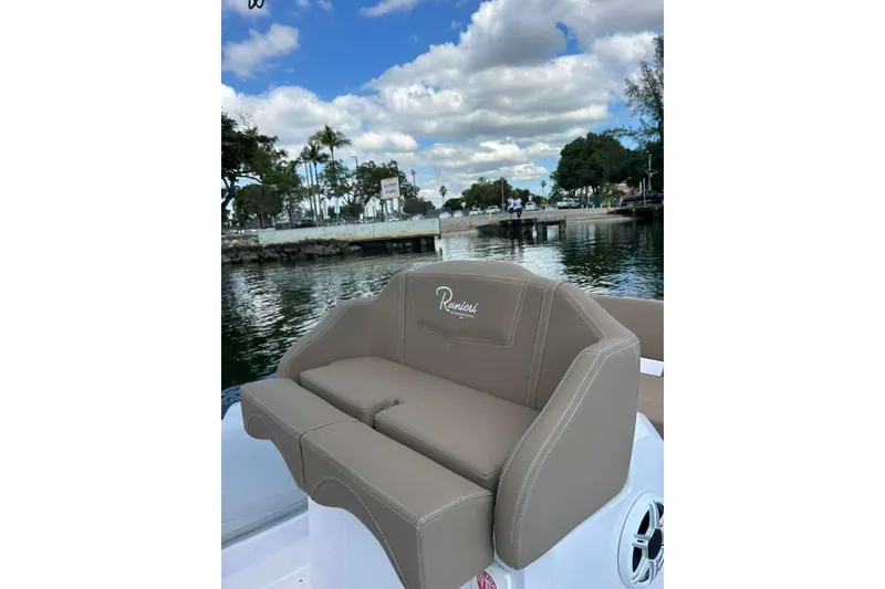 Slide: The Image of Ranieri CAYMAN 23 Sport 2026 boat seat with scenic waterfront view. - 18