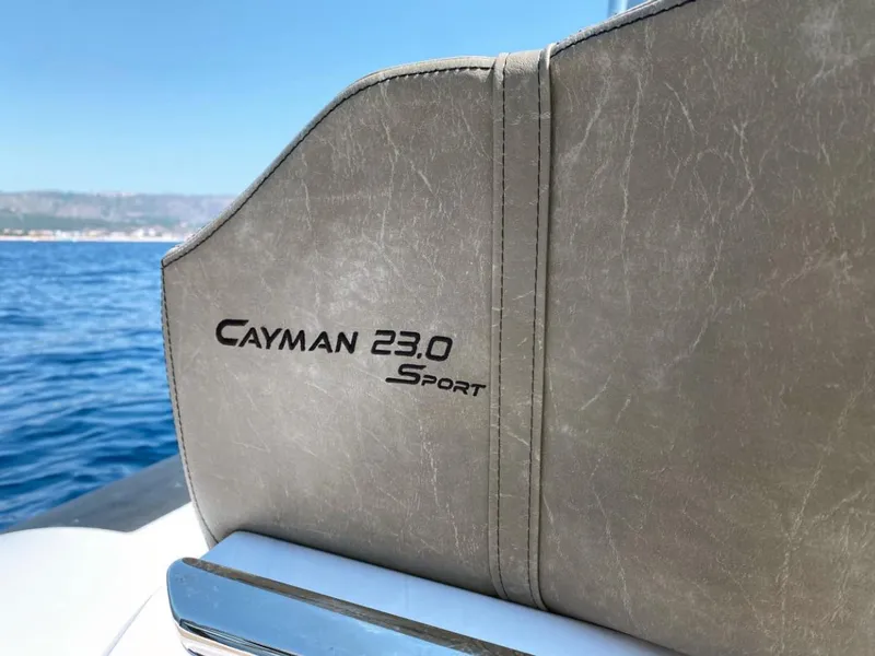 Slide: The Image of 2025 Ranieri CAYMAN 23 Sport boat seat detail with ocean backdrop. - 19