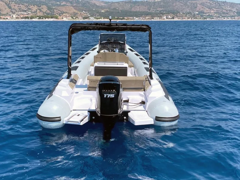 Slide: The Image of 2026 Ranieri CAYMAN 23 Sport boat on a calm waterway, rear view. - 5