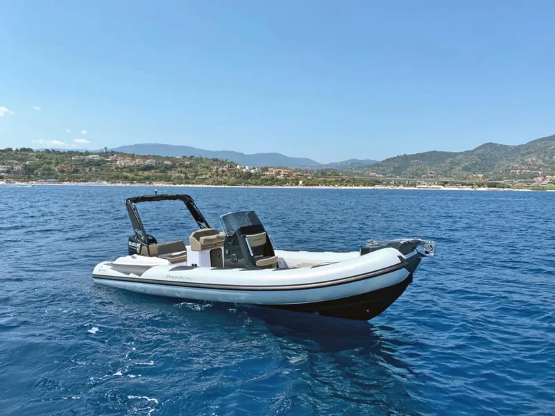 Slide: The Image of Ranieri CAYMAN 23 Sport 2026 boat with outboard motor on calm water. - 7