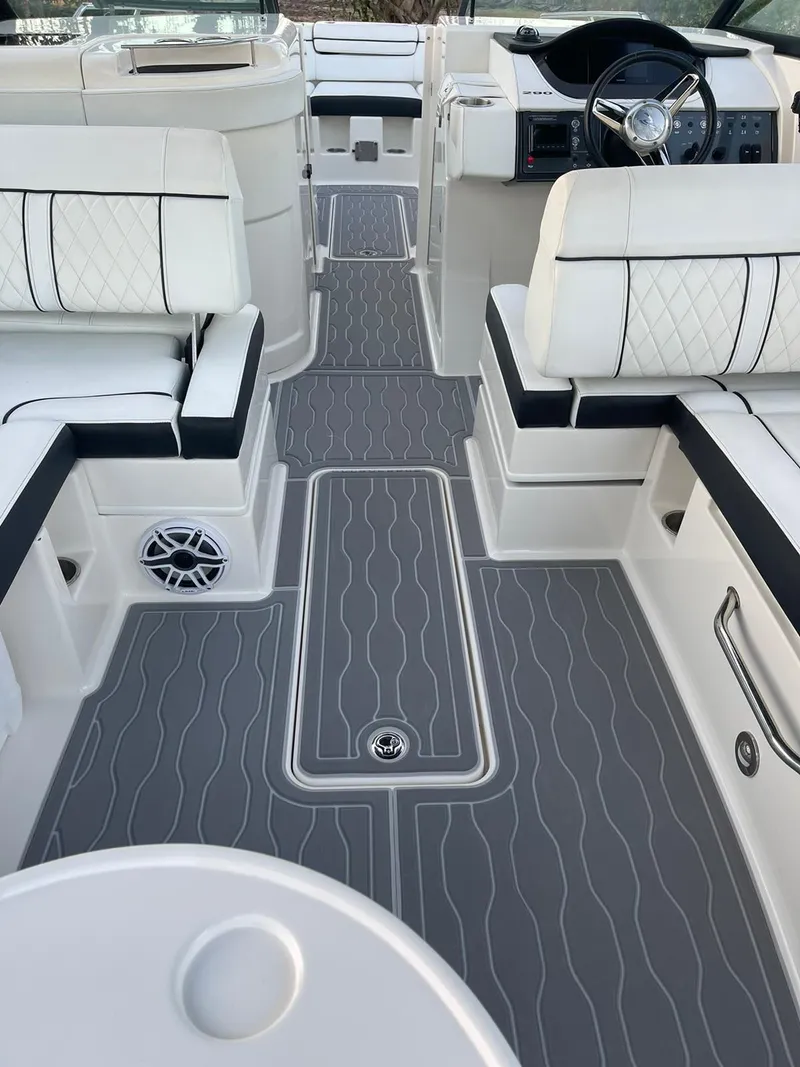 Slide: The Image of 2015 Sea Ray 290 Sundeck interior with sleek seating and modern design. - 12