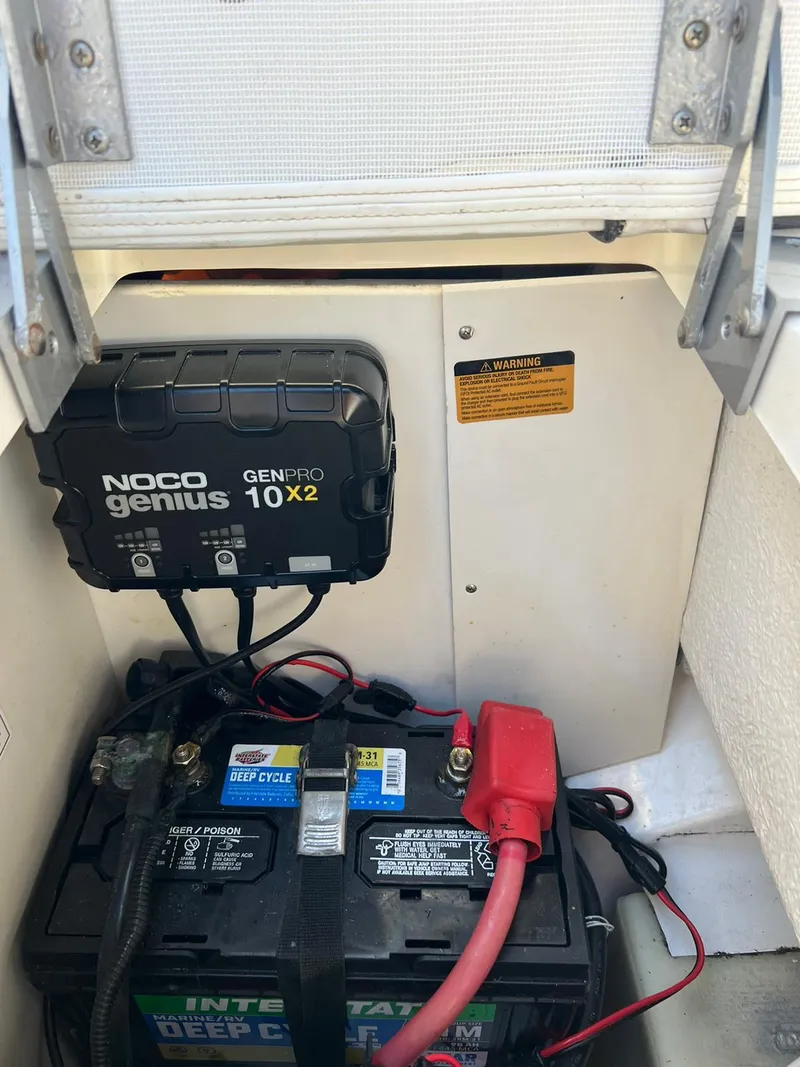 Slide: The Image of Battery compartment of a 2015 Sea Ray 290 Sundeck with NOCO Genius GENPRO 10X2 charger. - 17