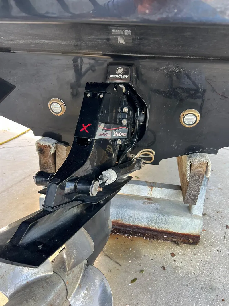 Slide: The Image of 2015 Sea Ray 290 Sundeck boat stern with propeller and outdrive detail. - 18