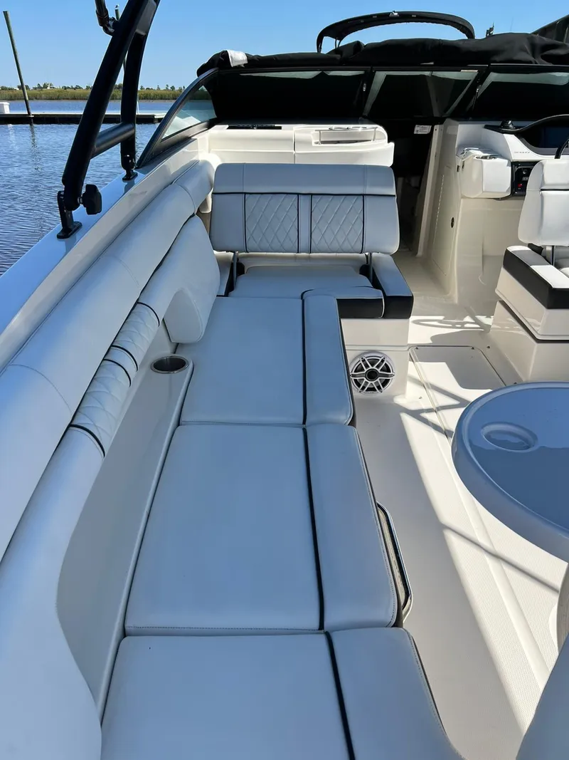 Slide: The Image of 2015 Sea Ray 290 Sundeck interior with spacious seating and modern design. - 5