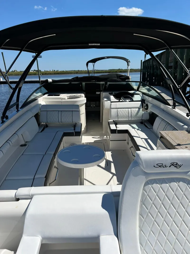 Slide: The Image of 2015 Sea Ray 290 Sundeck boat with spacious seating and sleek design on the water. - 6