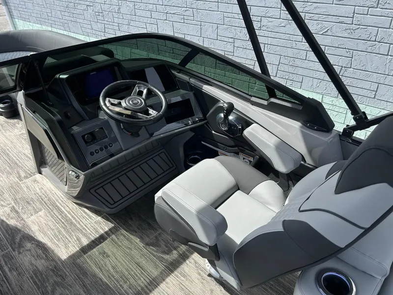 Slide: The Image of 2025 Avalon 2585 Catalina Quad Lounger Shift Windshield interior with modern steering and controls. - 10