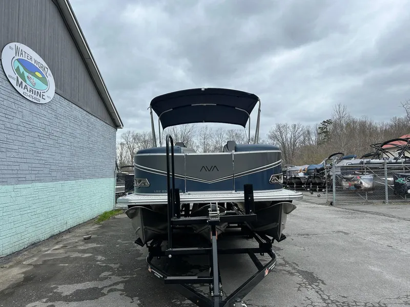 Slide: The Image of 2025 Avalon LSZ 2585 Quad Lounger Shift pontoon boat on trailer, parked at Waterworld Marine. - 4