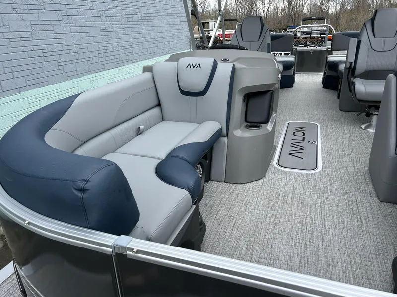 Slide: The Image of 2025 Avalon LSZ 2585 Quad Lounger Shift pontoon boat interior with gray and navy seating. - 7