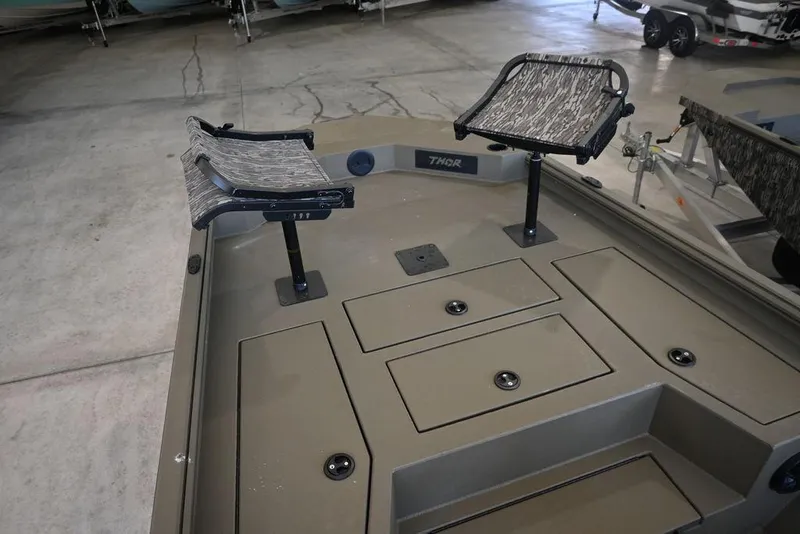 Slide: The Image of 2025 Thor Lake Hammer 1900CC boat interior with two seats and storage compartments. - 10