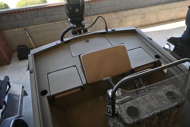 Slide: The Image of 2025 Thor Lake Hammer 1900CC boat interior with seating and storage compartments. - 7