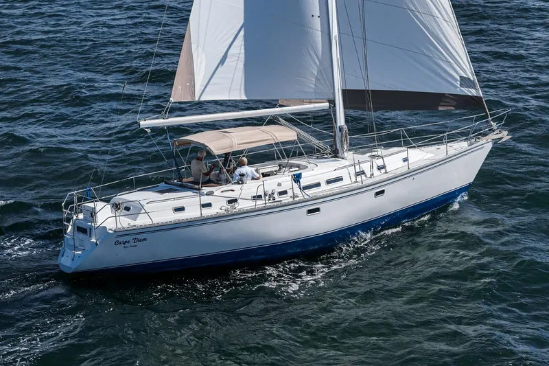 Slide: The Image of Sailing yacht Morgan 45 Catalina 1992 navigating on open water. - 10