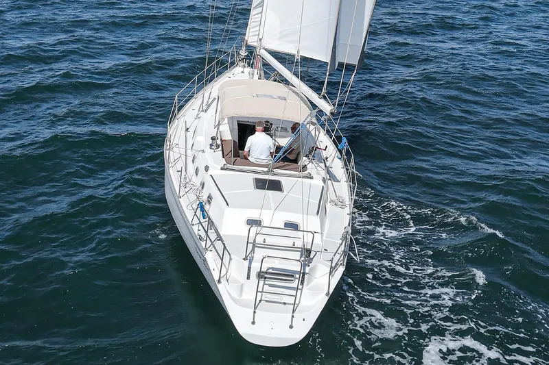 Slide: The Image of Sailing yacht Morgan 45 Catalina 1992 cruising on open water. - 11