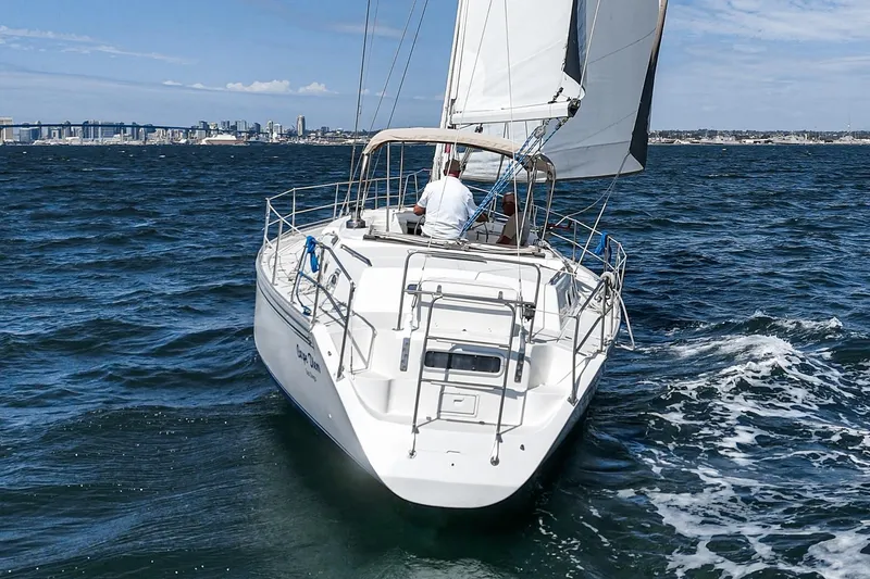 Slide: The Image of Sailing yacht Morgan 45 Catalina 1992 navigating open waters, aerial view. - 12