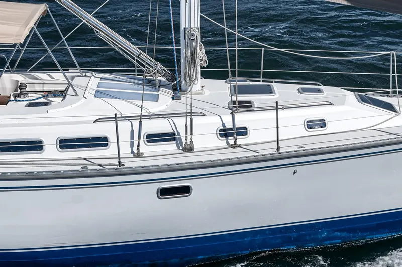 Slide: The Image of Sailing yacht Morgan 45 Catalina 1992 gliding on open water, showcasing sleek design. - 15