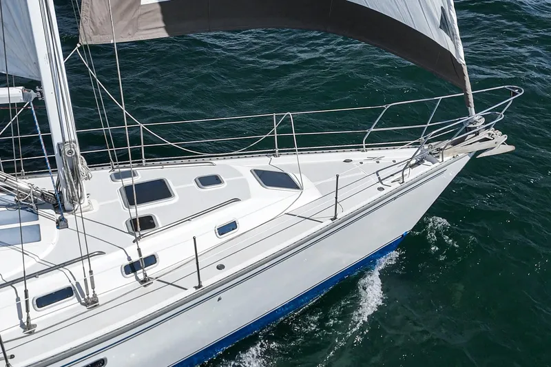 Slide: The Image of Sailing yacht Morgan 45 Catalina 1992 on open water, showcasing sleek deck design. - 17