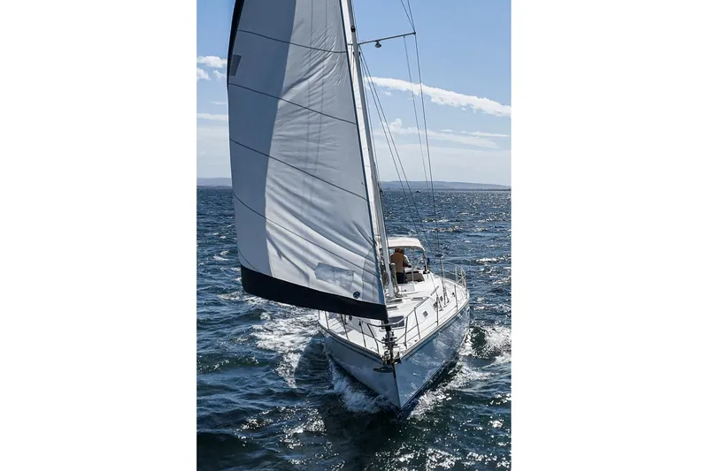 Slide: The Image of Sailing yacht Morgan 45 Catalina 1992 gliding on the ocean with full sails. - 19