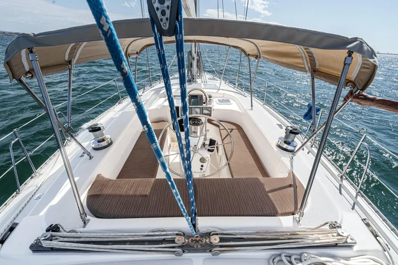 Slide: The Image of 1992 Morgan 45 Catalina sailboat cockpit with canopy, sailing on open water. - 28