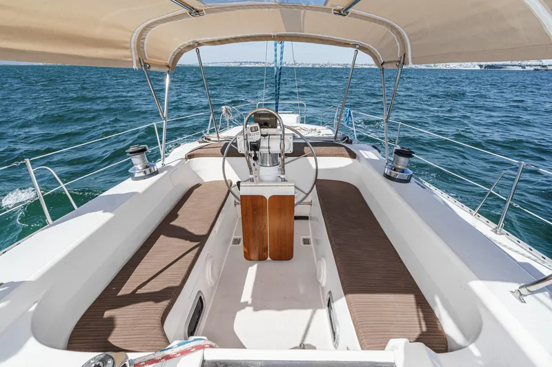 Slide: The Image of Cockpit of 1992 Morgan 45 Catalina sailboat with steering wheel and ocean view. - 32