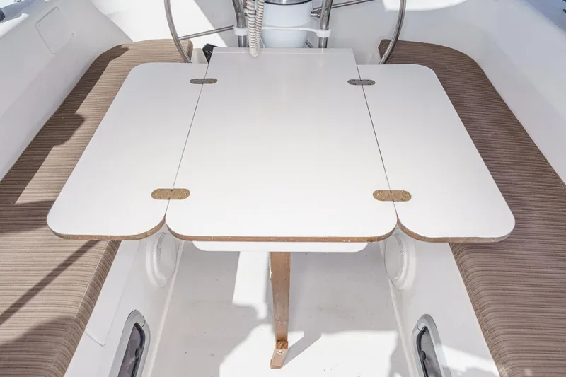 Slide: The Image of Interior of 1992 Morgan 45 Catalina sailboat with foldable table and cushioned seating. - 33