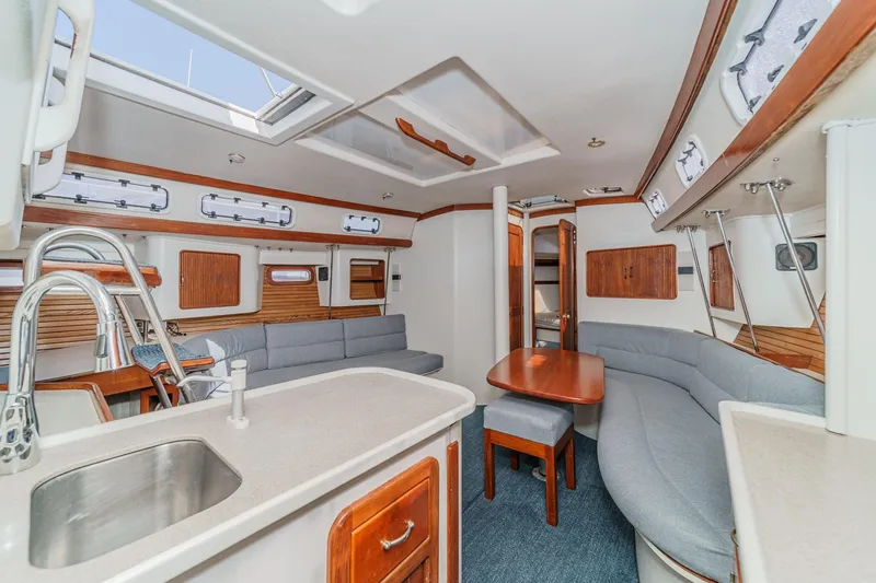 Slide: The Image of Interior of 1992 Morgan 45 Catalina yacht with modern kitchen and seating area. - 36