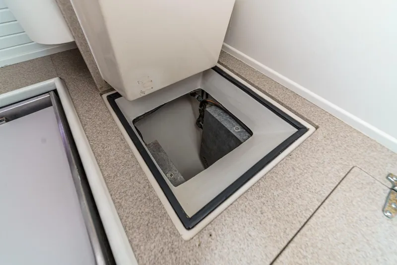 Slide: The Image of Open hatch on 1992 Morgan 45 Catalina boat, revealing storage compartment. - 41