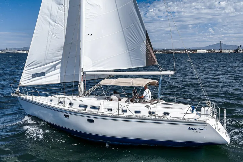 Slide: The Image of Luxurious 1992 Morgan 45 Catalina yacht cabin with wood accents and cozy bedding. - 5