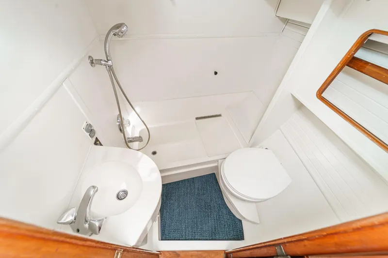 Slide: The Image of Bathroom interior of 1992 Morgan 45 Catalina yacht with shower, sink, and toilet. - 53